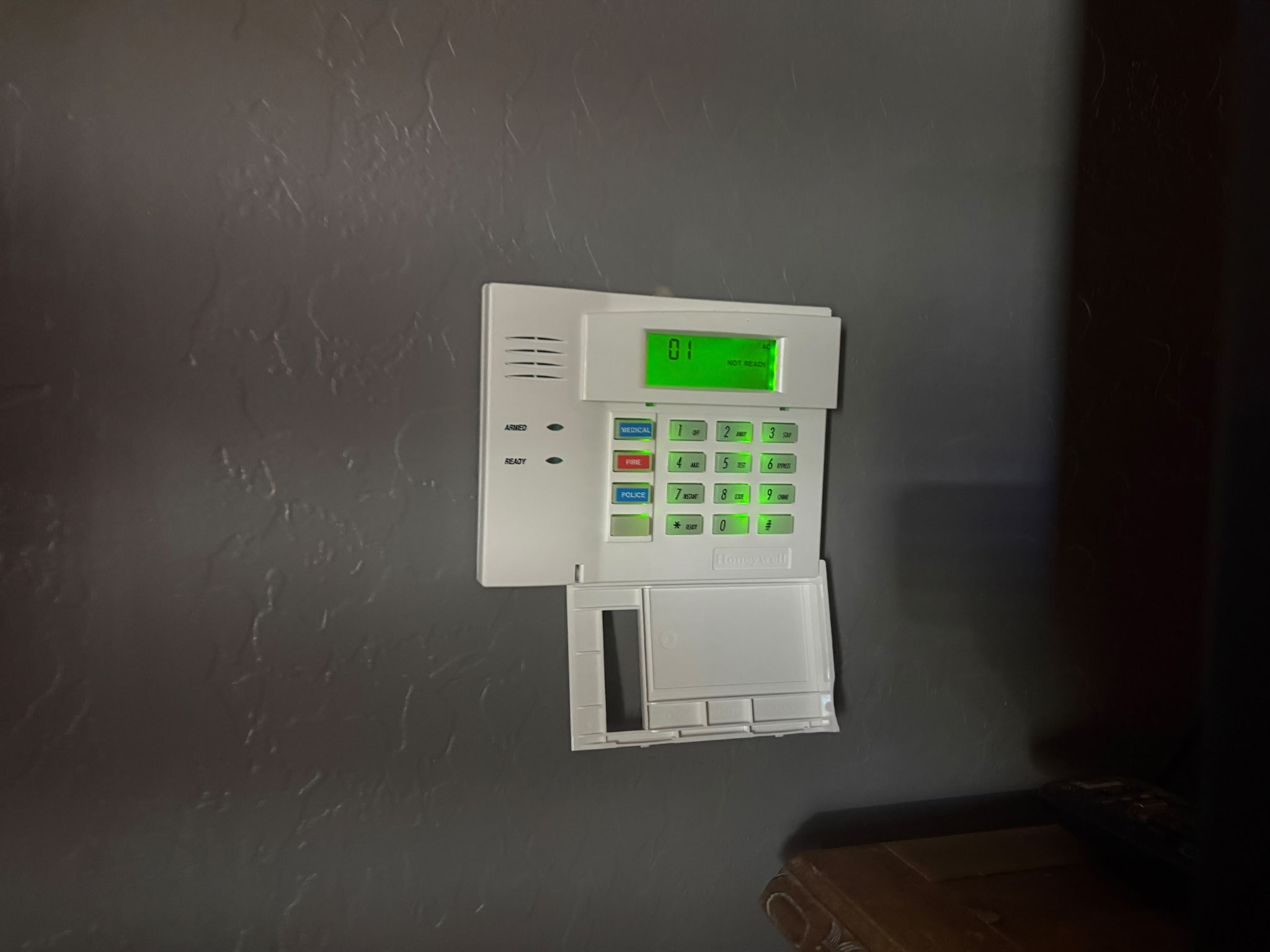 Existing Honeywell alarm keypad with green display, example for Cox Homelife takeover review