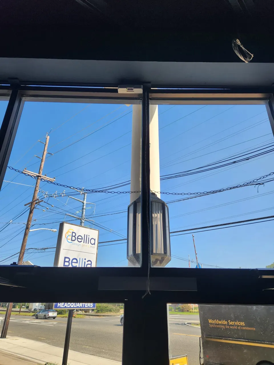 Magnetic-lock door assembly and request-to-exit sensor above commercial glass doors