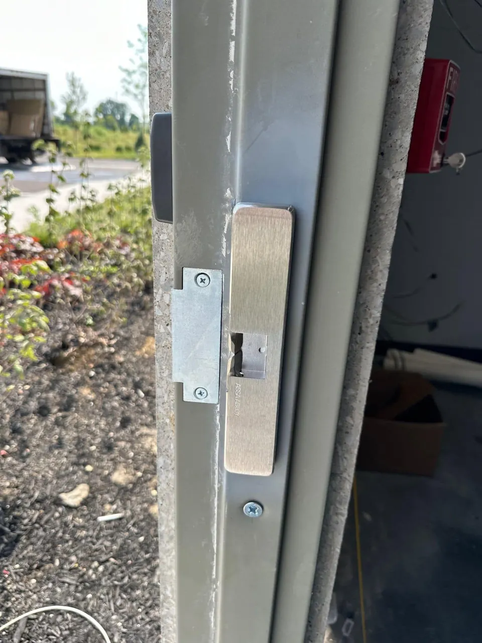 HES surface-mounted electric strike on commercial metal door frame