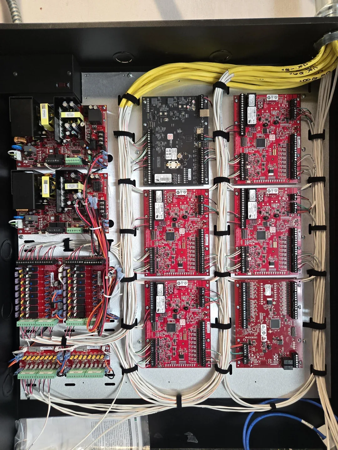 Organized access control circuit boards and wiring inside cabinet