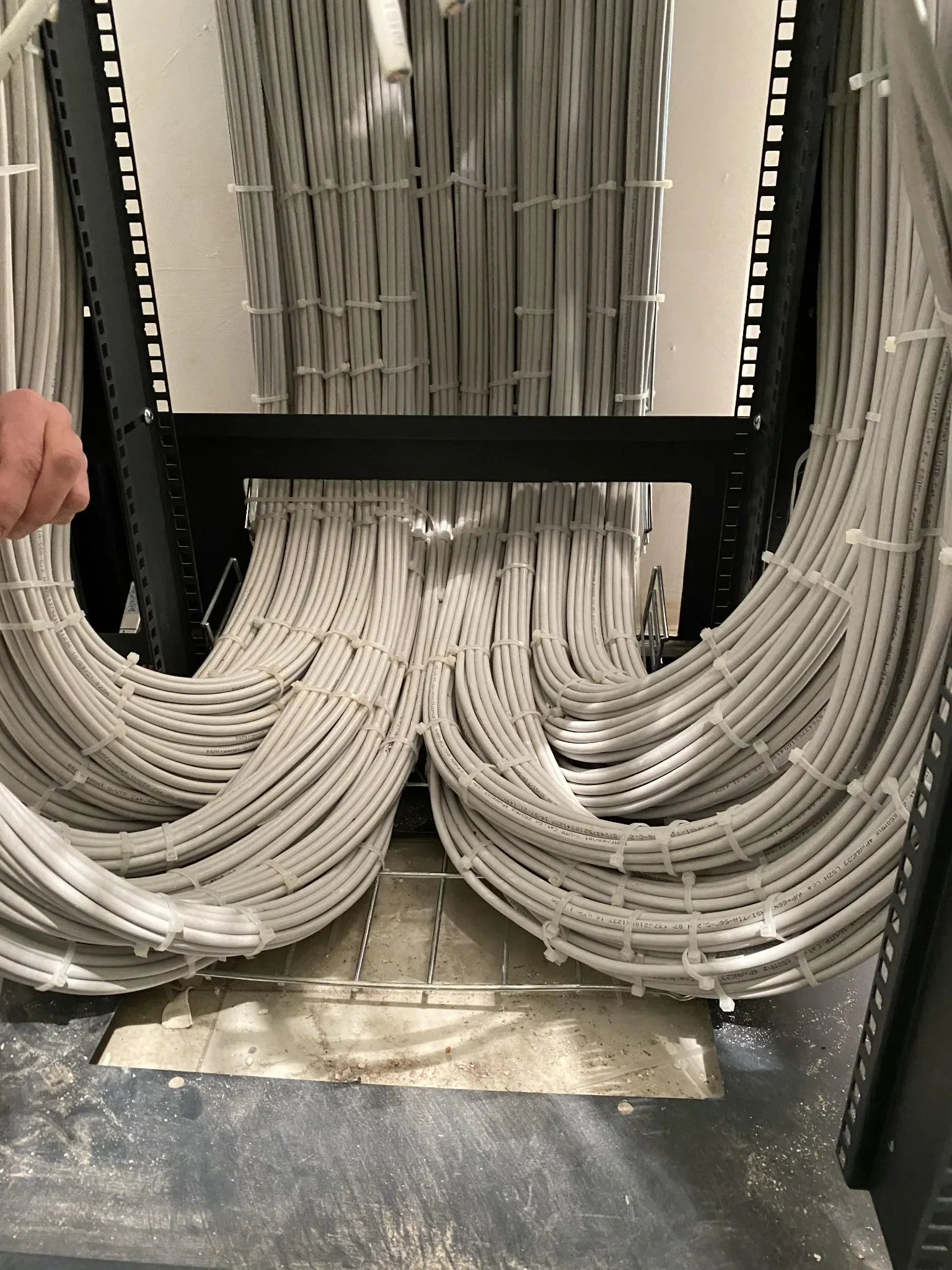 Organized structured cables entering commercial network rack